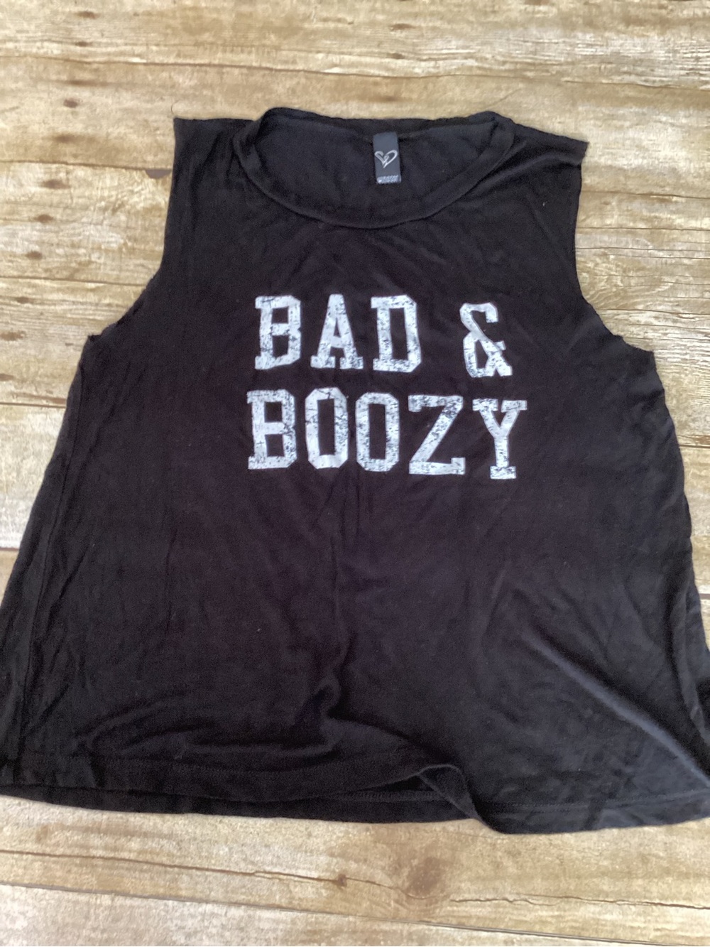 Black tank top with white text reading 'BAD & BOOZY'